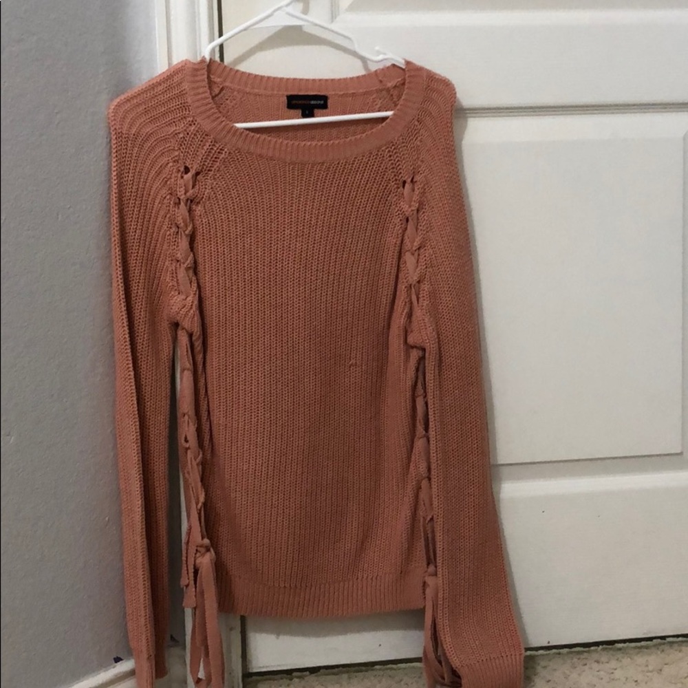 A long sleeve crewneck sweater